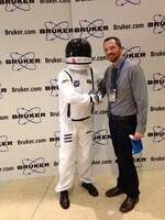spence shaking hands with astronaught from Bruker