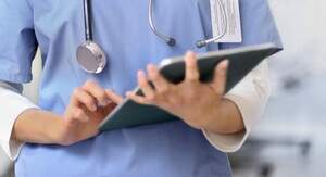 Clinical medical assistant reading chart Clinical medical assistant reading chart