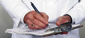 doctor with clipboard writing doctor with clipboard writing