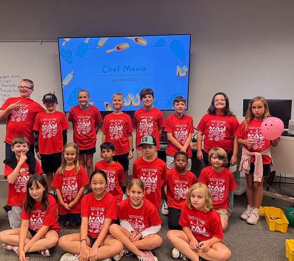 group of kids in red camp shirts