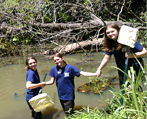 Natalie Powell, Vivian Welker and Leena Quinones work as a team to collect data.